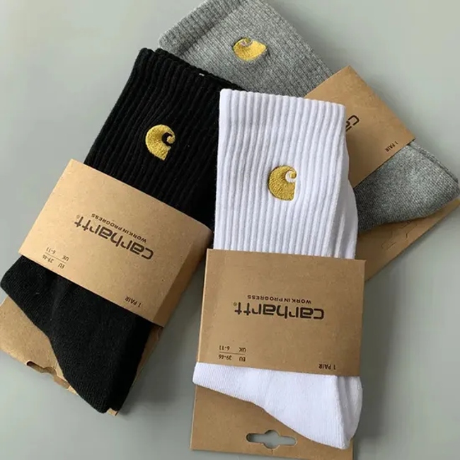 Vibrant Holiday Sock Packaging Featuring Unique Colorful Patterns